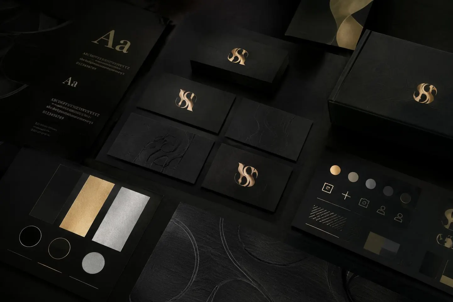 Illustrative brand identity presentation with business cards, type specimens and colour swatches